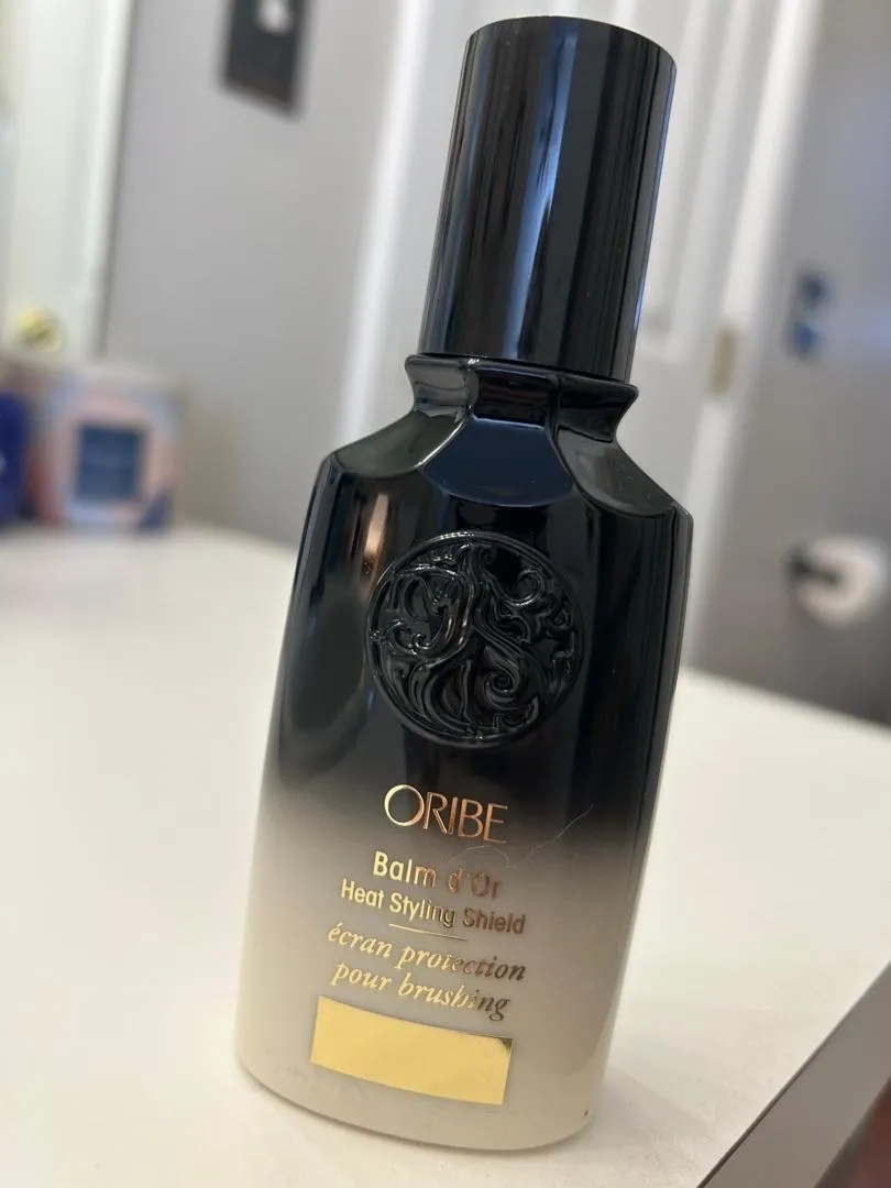 Oribe Balm d’Or Heat Styling Shield hittebeschermer standaard glad