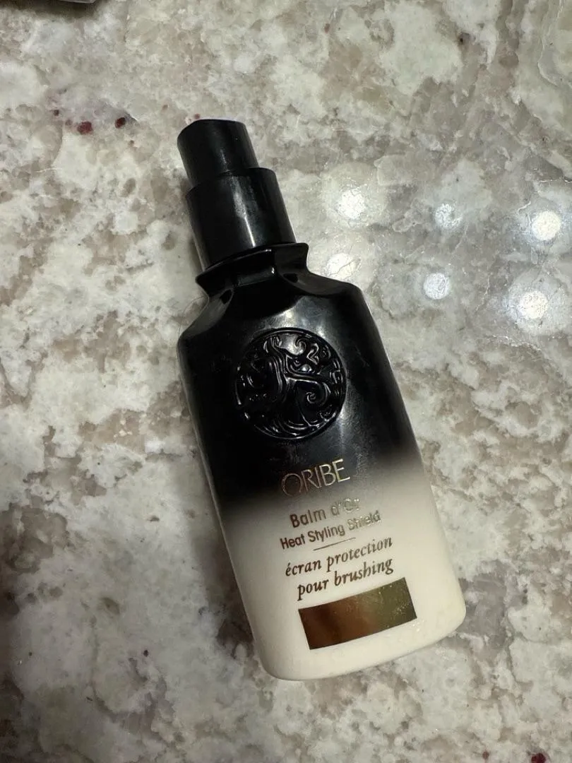 Oribe Balm d’Or Heat Styling Shield hittebeschermer standaard glad